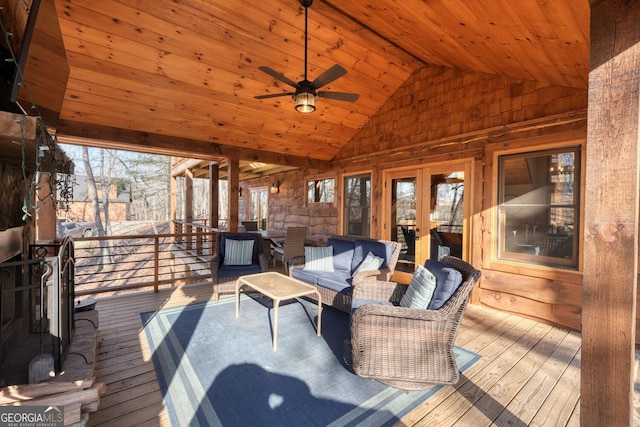 wooden deck featuring ceiling fan and an outdoor living space