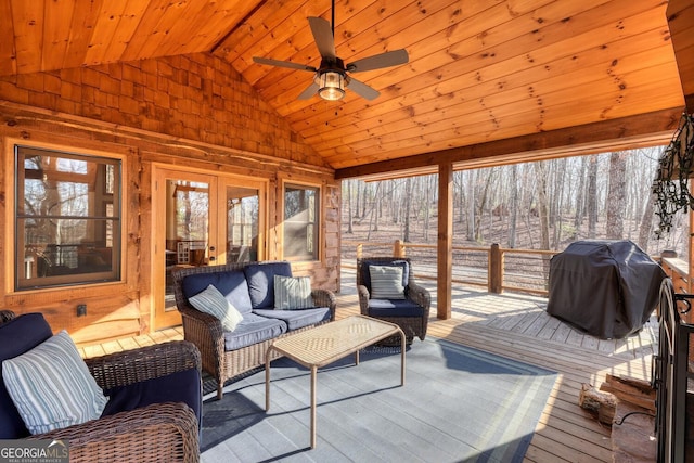 sunroom / solarium featuring vaulted ceiling, ceiling fan, french doors, and wooden ceiling