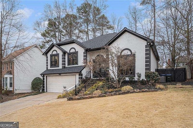 view of front of property featuring stairway, stucco siding, driveway, a garage, and a front yard