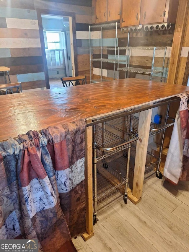 bar with light wood-style floors