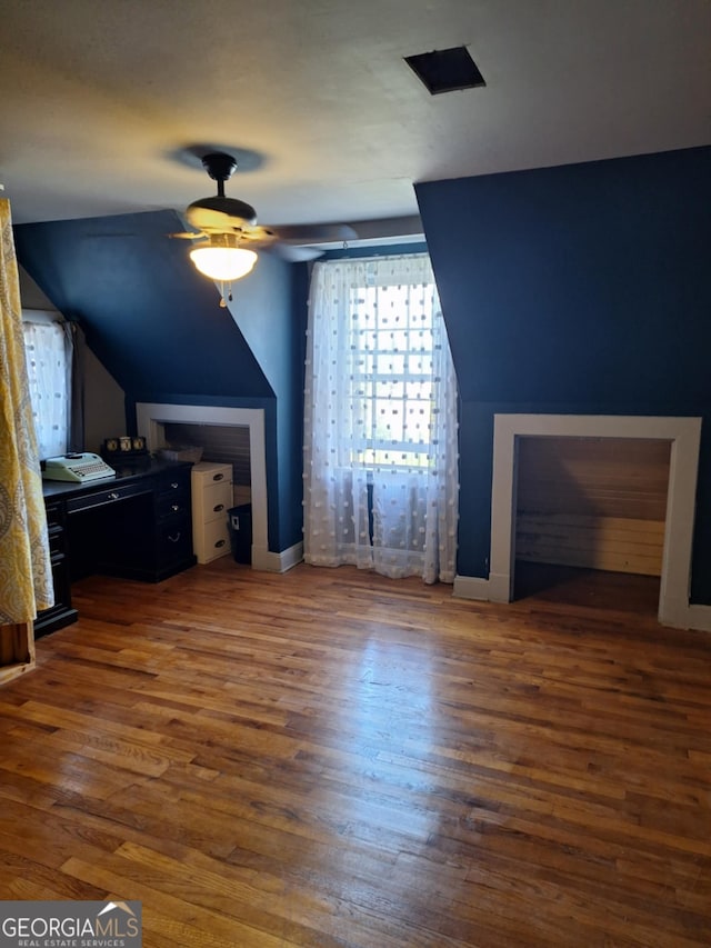 bonus room with ceiling fan, wood finished floors, and lofted ceiling