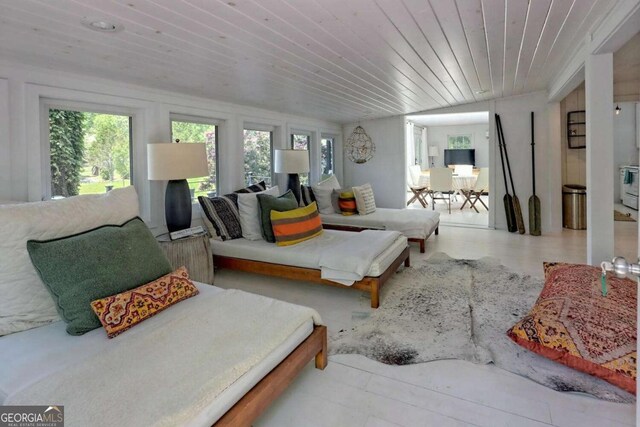 living area featuring wooden ceiling and vaulted ceiling