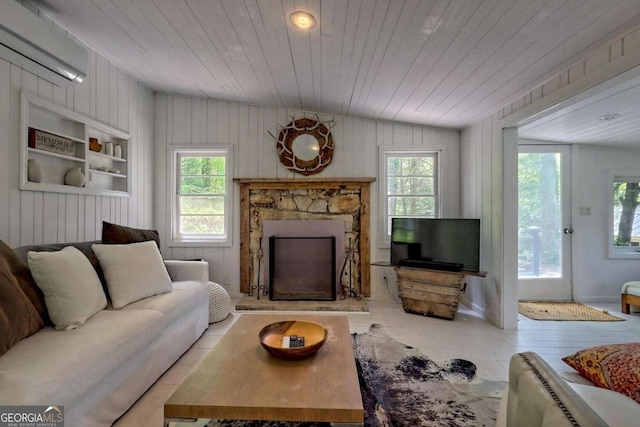 living area with vaulted ceiling, a fireplace with raised hearth, wood ceiling, and light wood-style floors