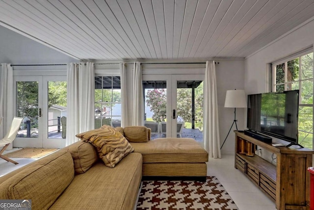 living room featuring light tile patterned floors, wood ceiling, a wealth of natural light, and french doors