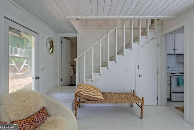 entrance foyer with stairs and wooden ceiling