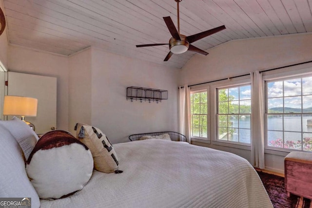 bedroom featuring a water view, wood ceiling, a ceiling fan, and lofted ceiling