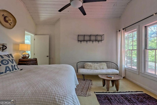 carpeted bedroom with lofted ceiling, wooden ceiling, a ceiling fan, and baseboards