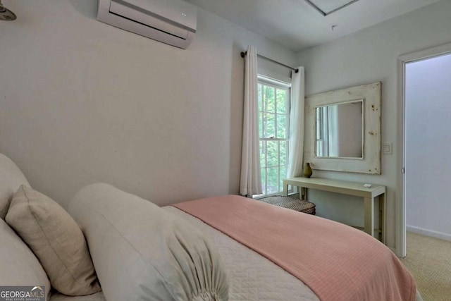 carpeted bedroom with an AC wall unit and baseboards