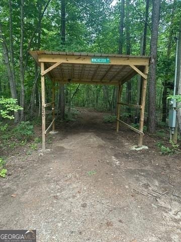 view of parking / parking lot with a detached carport