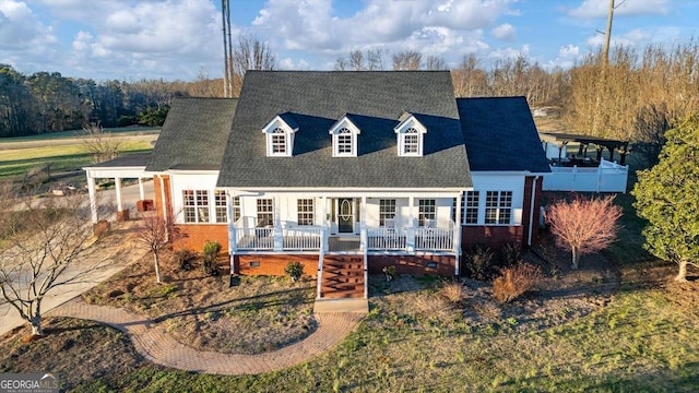 back of house featuring roof with shingles, a porch, and crawl space