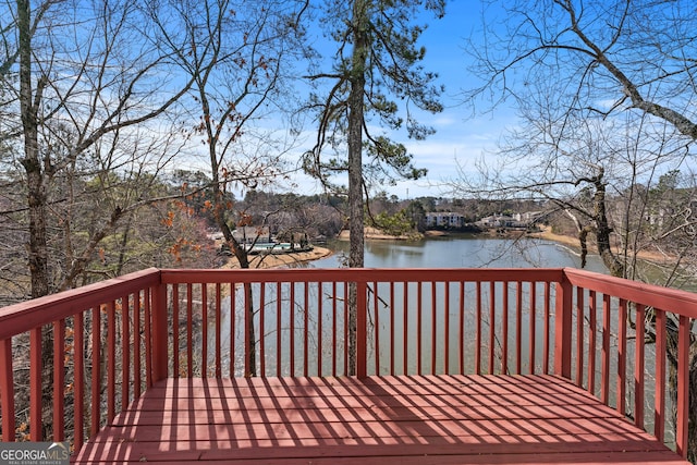 wooden deck with a water view