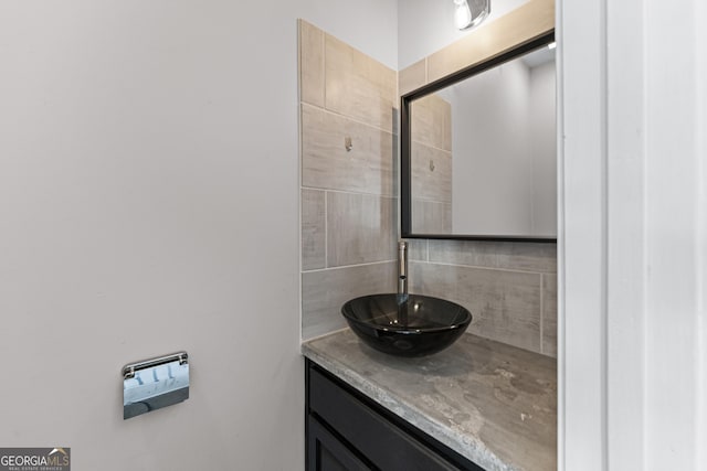 bathroom featuring backsplash and vanity