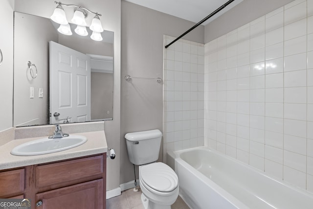 bathroom featuring toilet, tile patterned floors, washtub / shower combination, and vanity