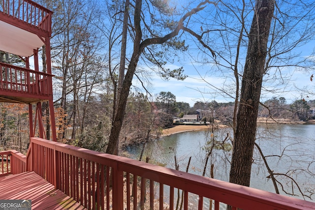 wooden deck with a water view