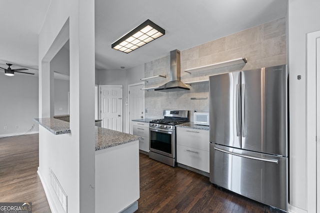 kitchen with light stone counters, stainless steel appliances, ventilation hood, white cabinetry, and open shelves