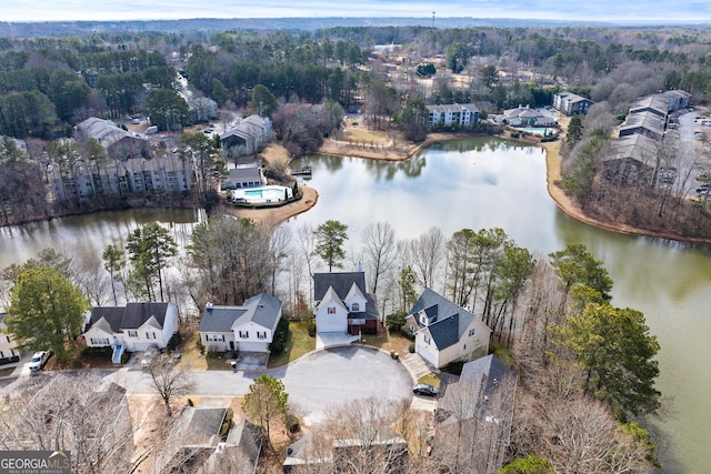 birds eye view of property with a water view and a residential view