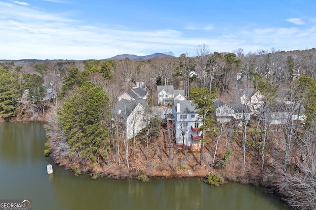 drone / aerial view featuring a water and mountain view