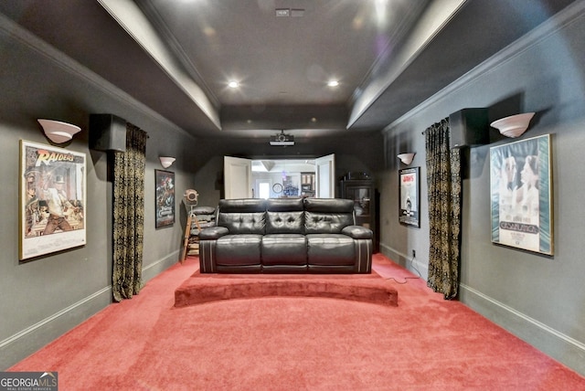 carpeted cinema with baseboards, recessed lighting, a raised ceiling, and crown molding