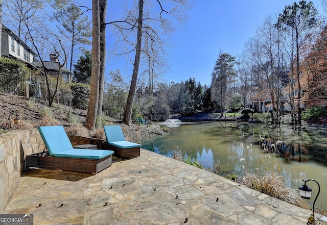 view of patio / terrace featuring a water view