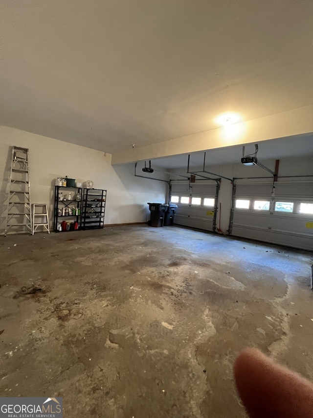 garage featuring a garage door opener