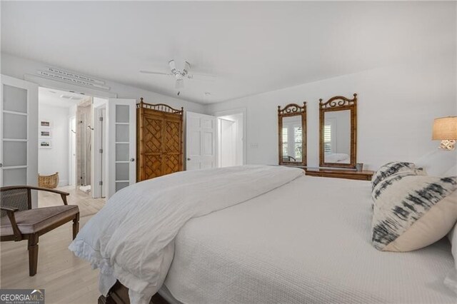 bedroom with ceiling fan and light wood-style flooring