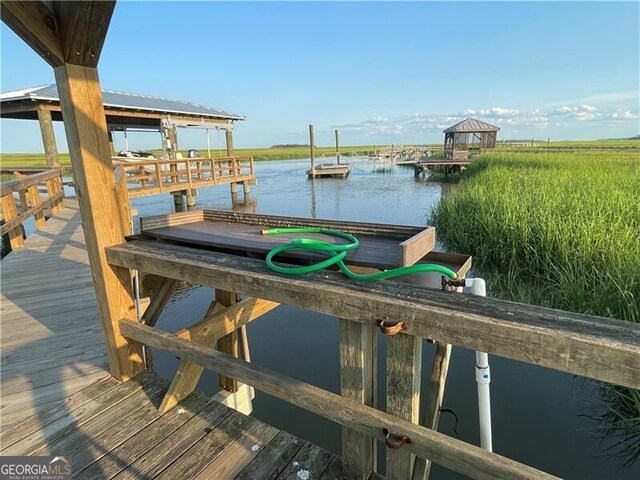 view of dock with a water view