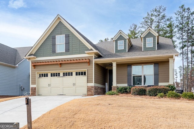 craftsman house with driveway and roof with shingles