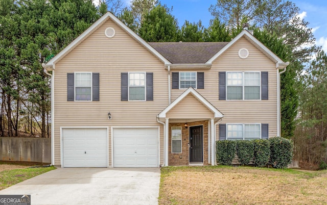 view of front of house featuring an attached garage, concrete driveway, a front yard, and fence