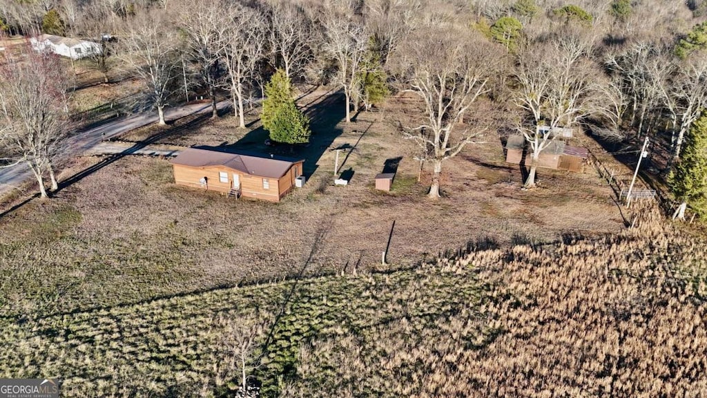 birds eye view of property featuring a rural view