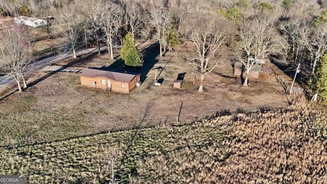 birds eye view of property featuring a rural view