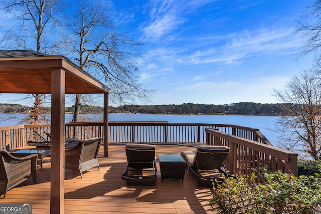 deck featuring a water view