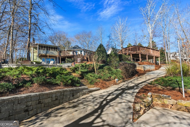 back of property featuring a wooden deck