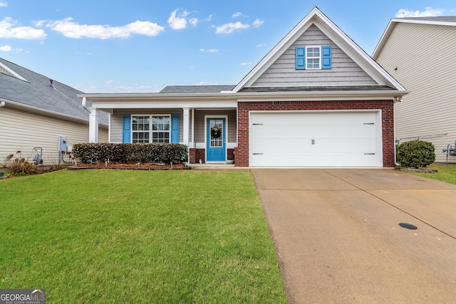 view of front of home with an attached garage, concrete driveway, brick siding, and a front yard