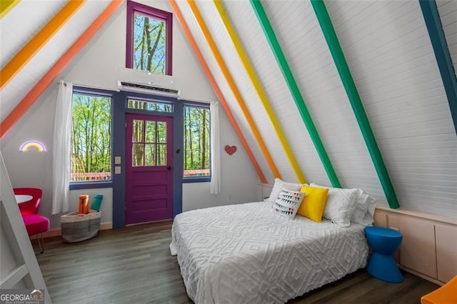 bedroom with dark wood-type flooring, a wall mounted air conditioner, and lofted ceiling with beams