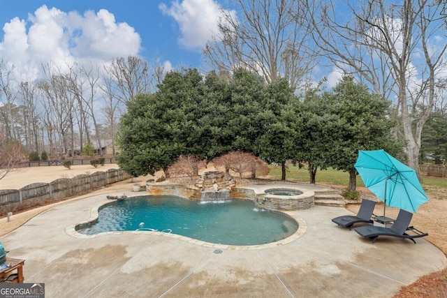 view of pool with a patio area, a fenced backyard, and a pool with connected hot tub