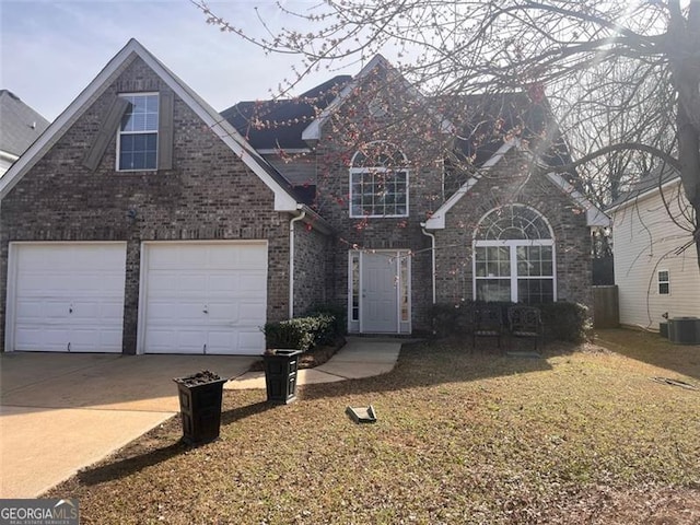 traditional home with a garage, concrete driveway, brick siding, and cooling unit