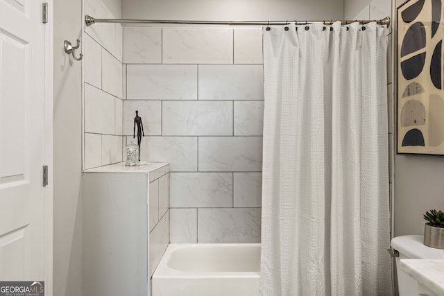 bathroom with toilet and shower / tub combo