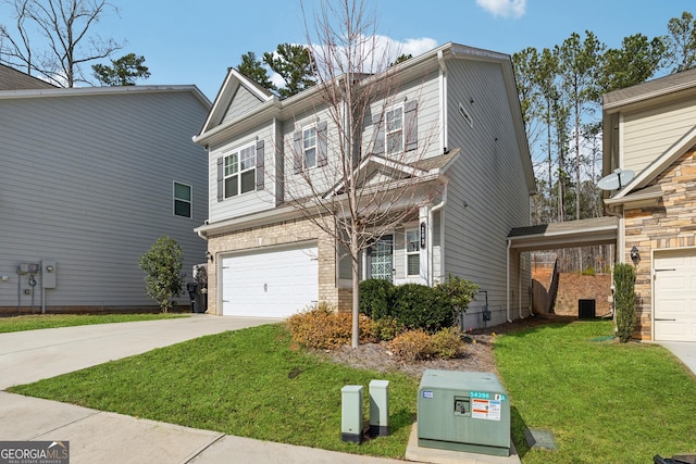 view of front of home with concrete driveway, brick siding, a front lawn, and an attached garage