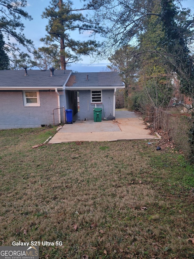 2335 Boulder Rd SE, Atlanta, GA 30316 - back of property featuring a patio area, brick siding, a lawn, and fence