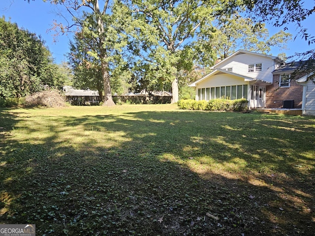 view of yard with a sunroom