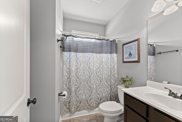 full bathroom featuring toilet, shower / bath combo, and vanity