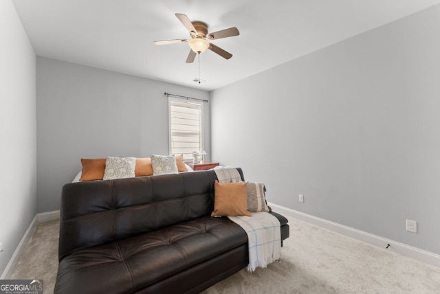 living room with carpet floors, ceiling fan, and baseboards