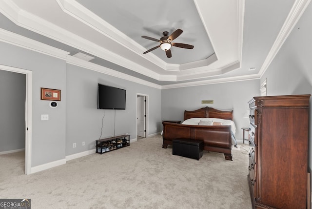 carpeted bedroom with ornamental molding, a raised ceiling, baseboards, and a ceiling fan