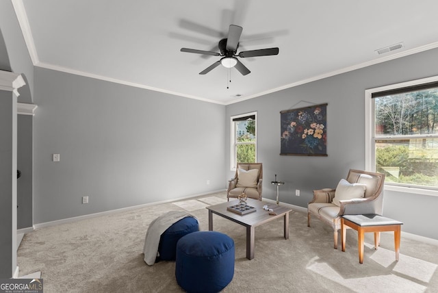 sitting room featuring baseboards, visible vents, carpet flooring, and ornamental molding