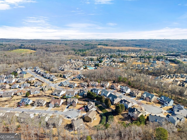 birds eye view of property with a residential view