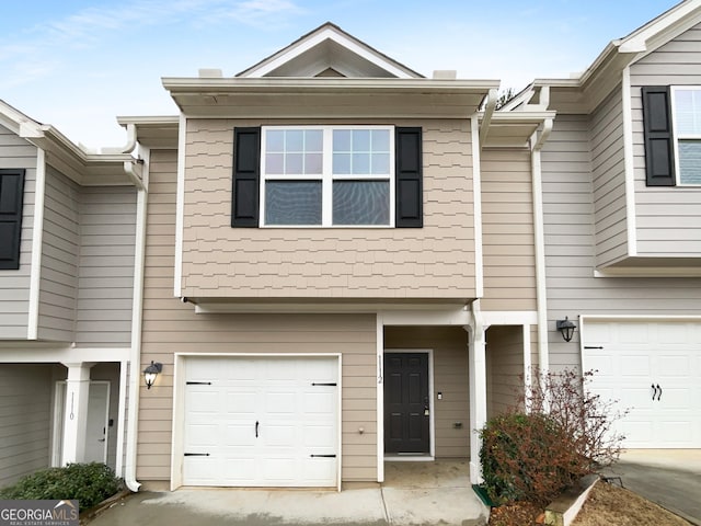 townhome / multi-family property with an attached garage