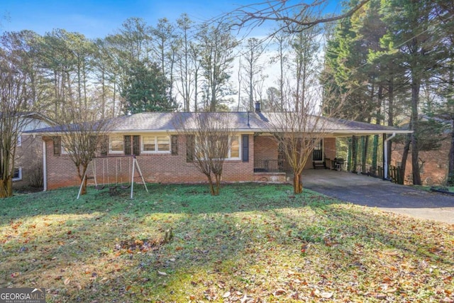 single story home featuring driveway, an attached carport, a front lawn, and brick siding