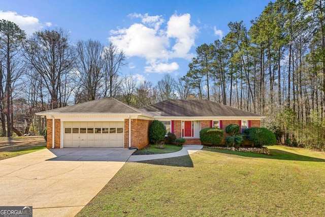 single story home with driveway, a front yard, a garage, and brick siding