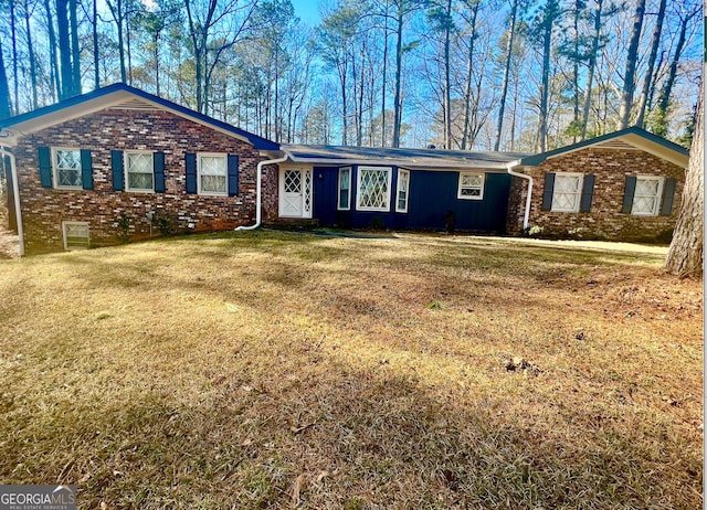 ranch-style home with a front lawn and brick siding