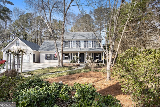 colonial house with a garage and driveway